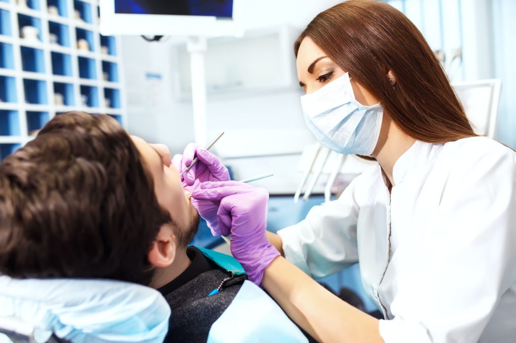 Professional dentist doctor working. Lady woman at dentist taking care of teeth.